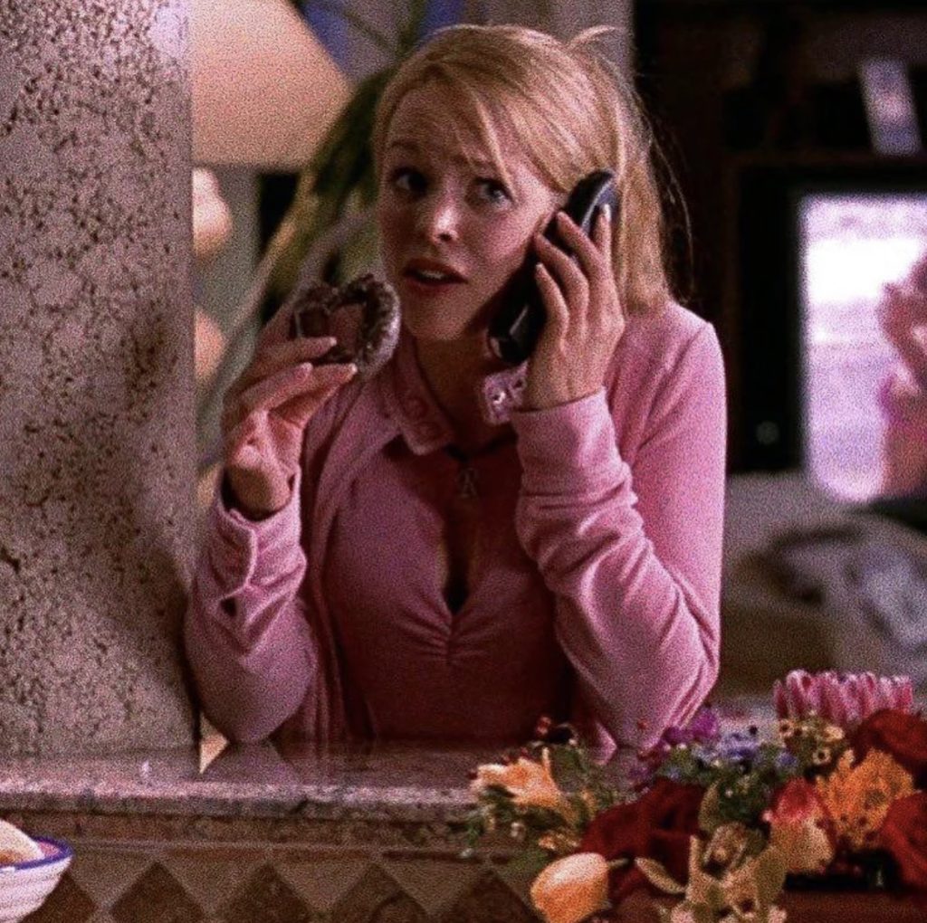 Rachel McAdams as Regina George in Mean Girls in an all pink tracksuit.